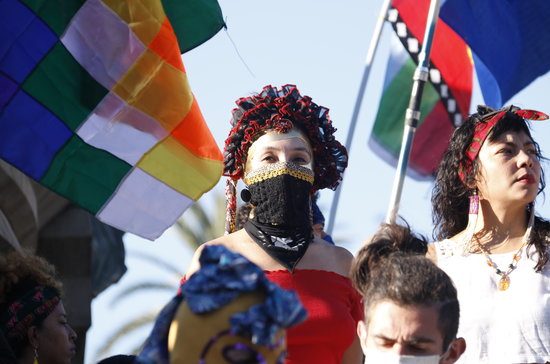 An anti-colonialist protester in Barcelona on Spain's National Day (by Gerard Artigas)